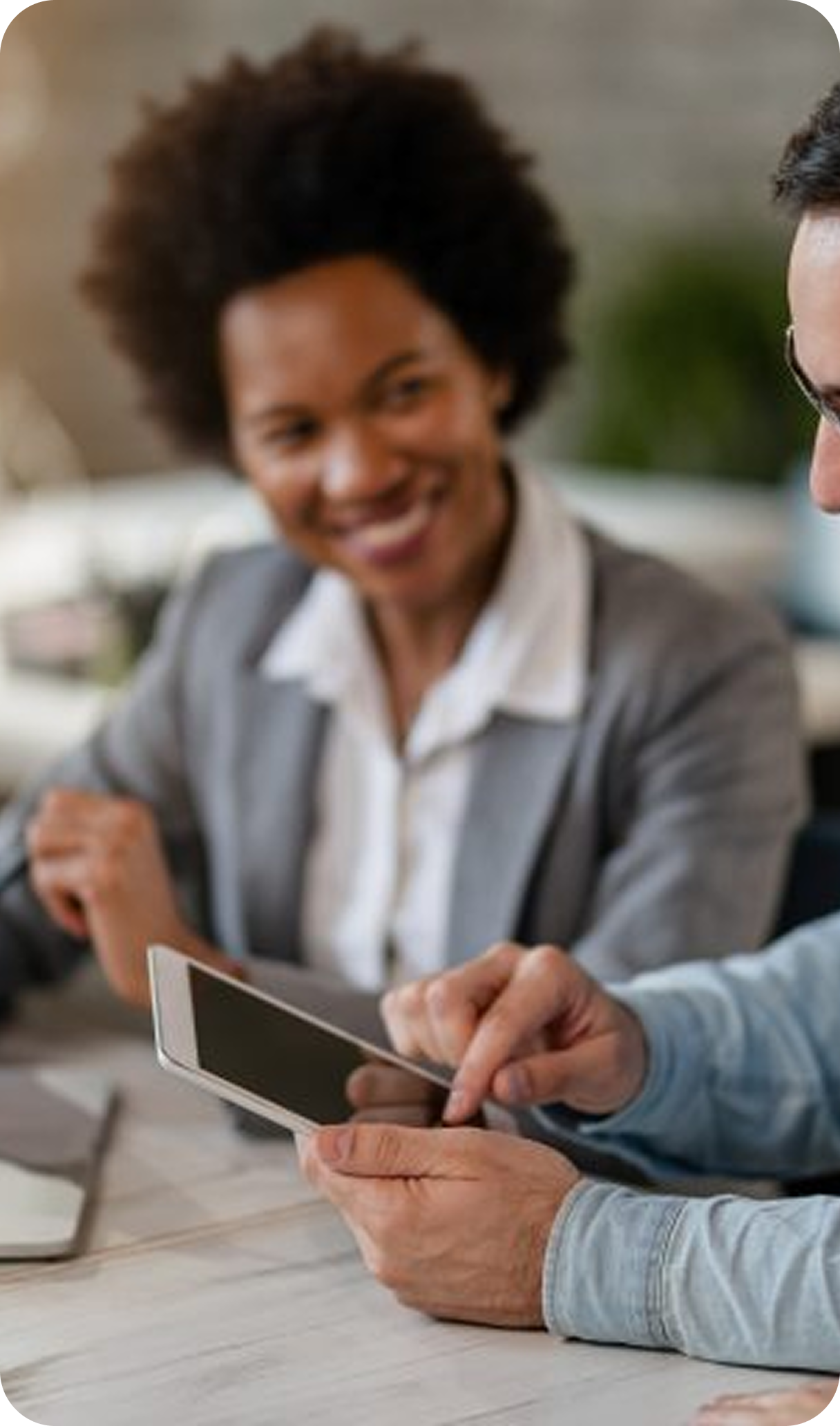 Professional reviewing compliance information on a tablet